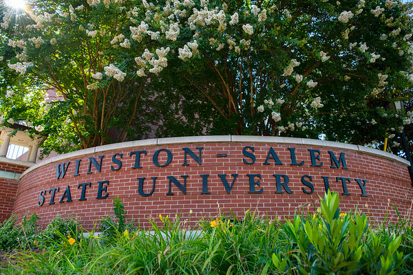Winston-Salem State University entrance sign made of brick with large black lettering.